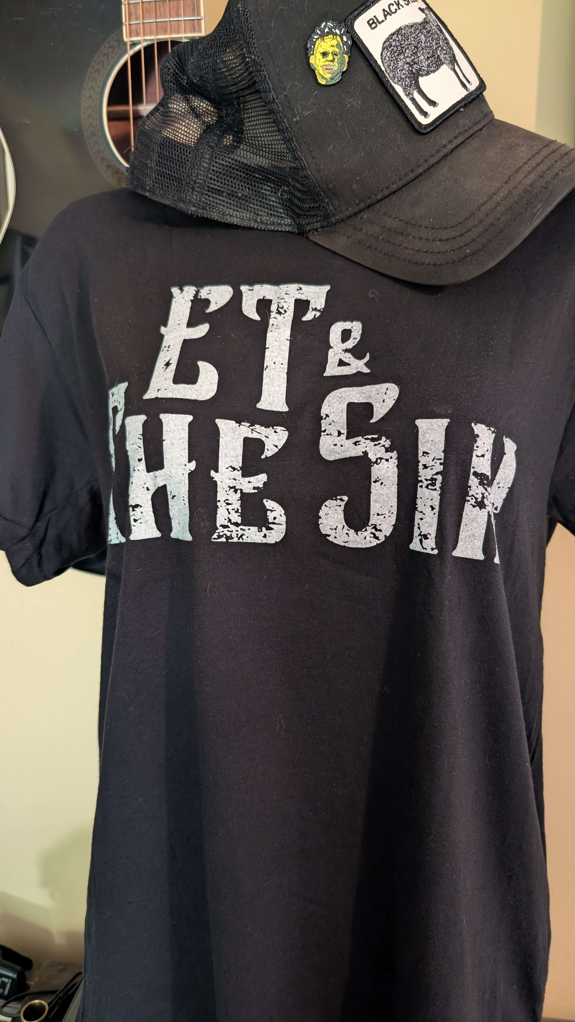 a black t - shirt with the words eat the six on it